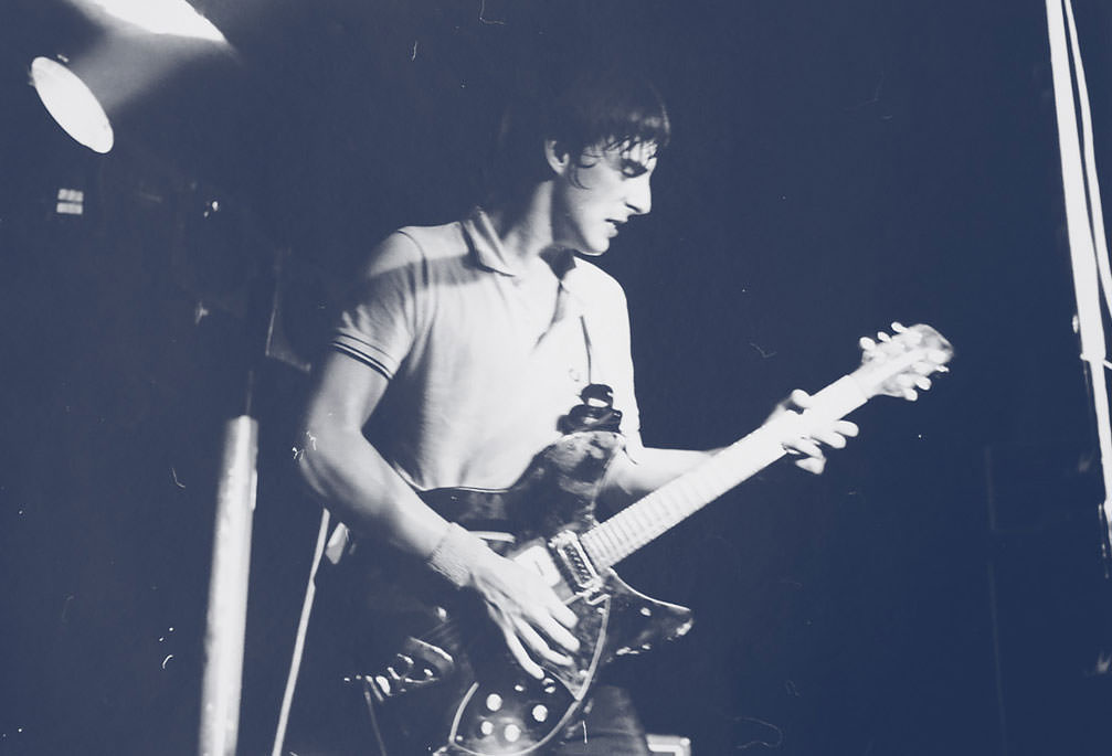 Paul Weller wearing a Fred Perry Shirt